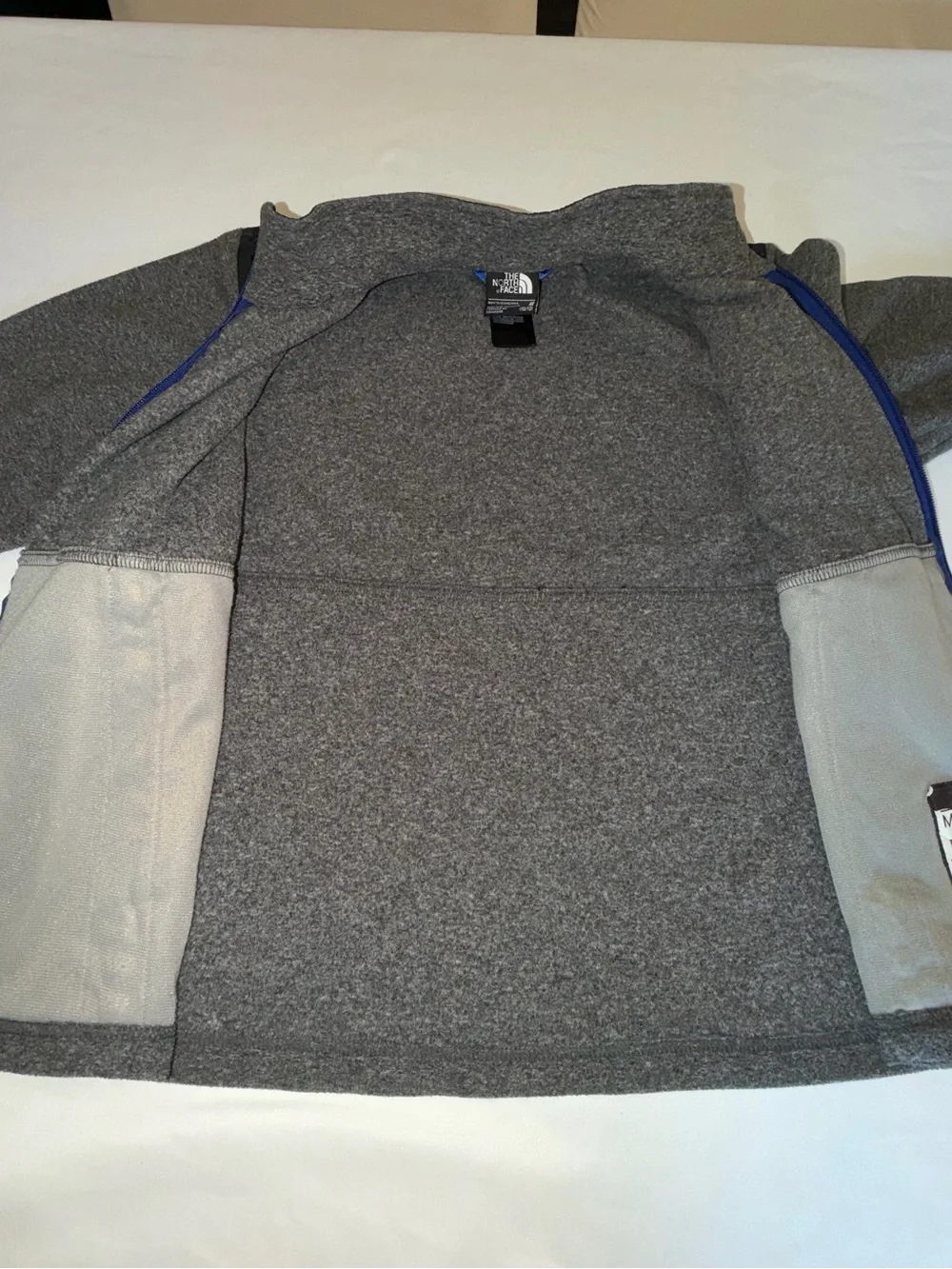 The North Face Kids Black and Gray Jacket with Blue Zip. C13,EMP